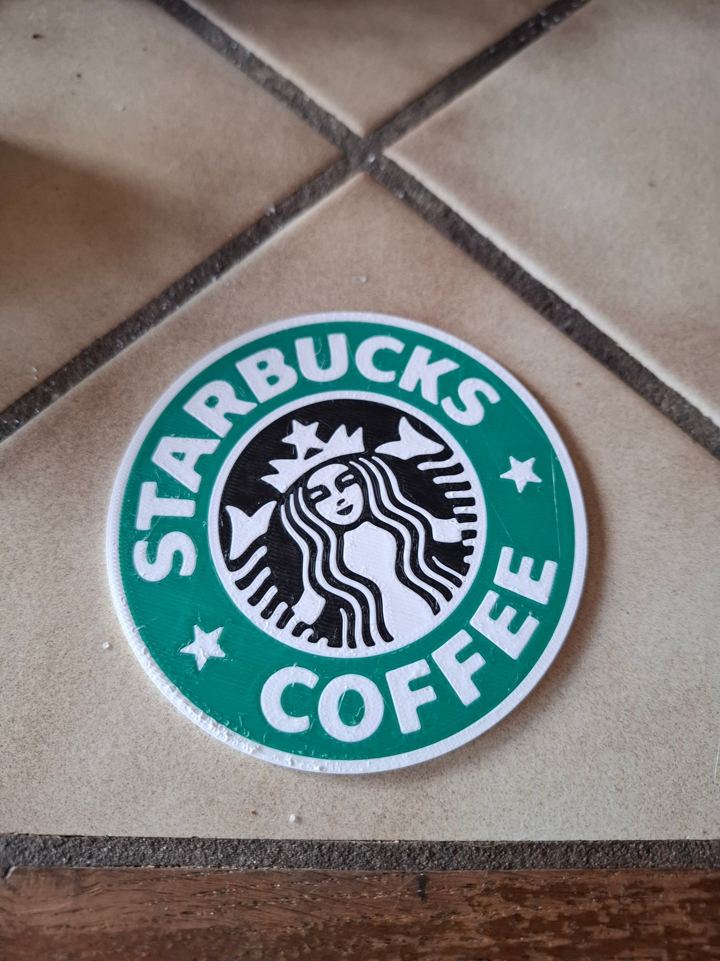 onderzetter met starbucks logo